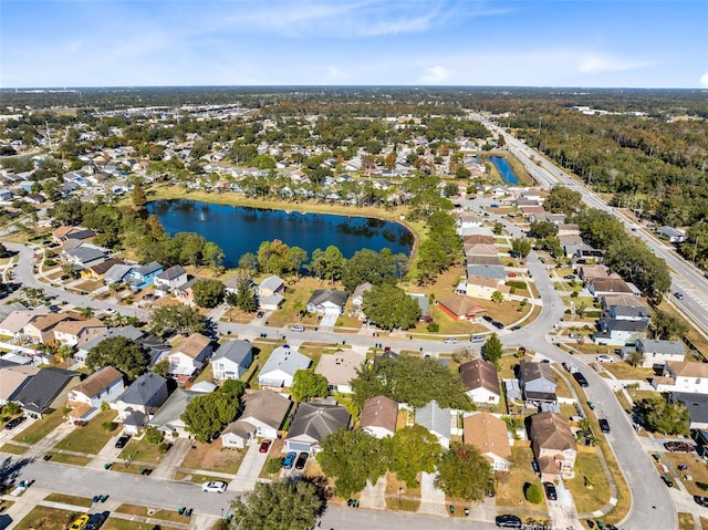 birds eye view of property featuring a water view and a residential view