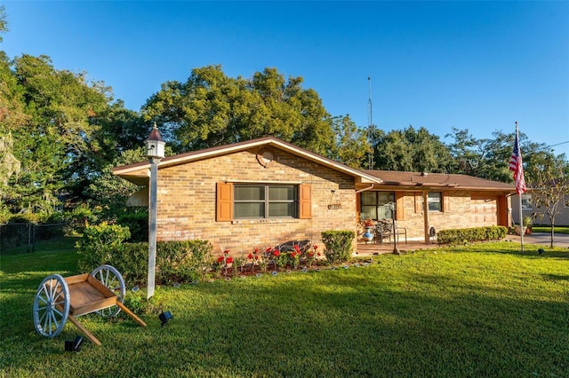 single story home with a front yard