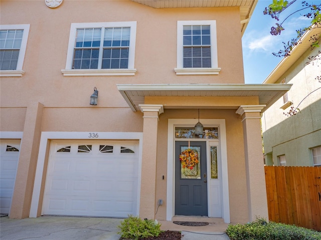 view of exterior entry with a garage