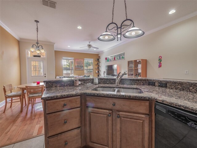 kitchen with ornamental molding, ceiling fan with notable chandelier, sink, light hardwood / wood-style flooring, and dishwasher