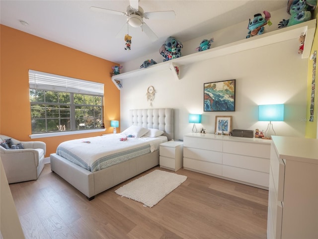 bedroom with ceiling fan and light wood-type flooring