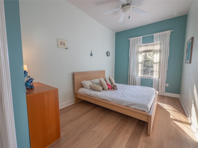 bedroom with light wood-type flooring and ceiling fan