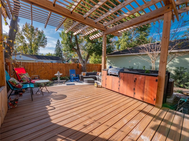 wooden terrace with an outdoor hangout area, a pergola, and grilling area