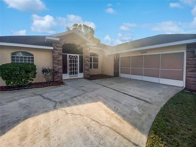 single story home with a garage