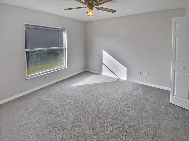 spare room featuring carpet and ceiling fan