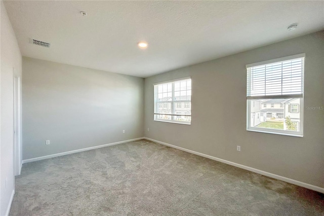 view of carpeted spare room