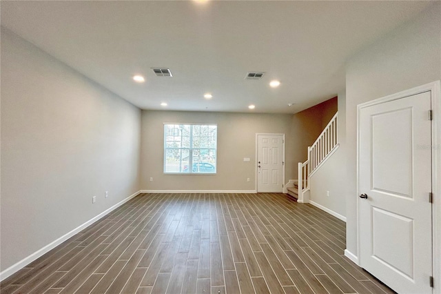 spare room with dark hardwood / wood-style floors