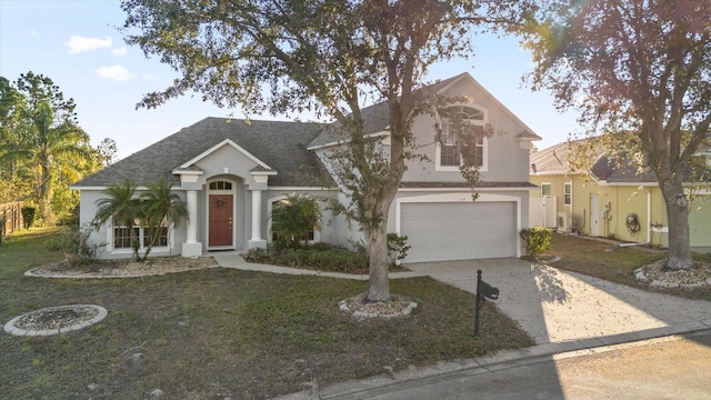 view of front of home with a front lawn and a garage