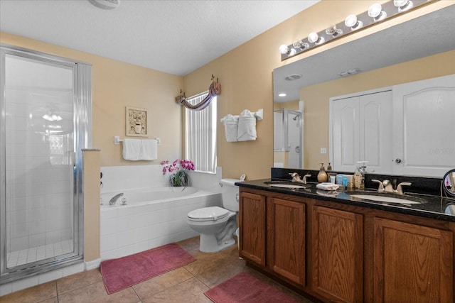 full bathroom with tile patterned flooring, a textured ceiling, vanity, and independent shower and bath