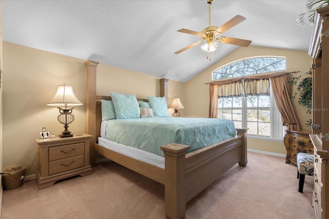 carpeted bedroom with a textured ceiling, ceiling fan, and vaulted ceiling