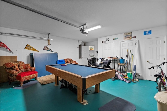 recreation room featuring a textured ceiling, pool table, and concrete floors