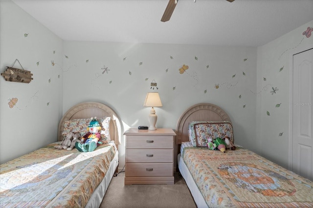 bedroom with ceiling fan and light carpet