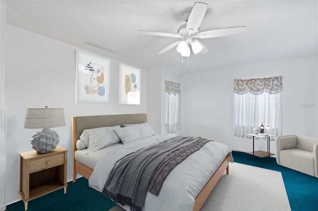 carpeted bedroom with ceiling fan