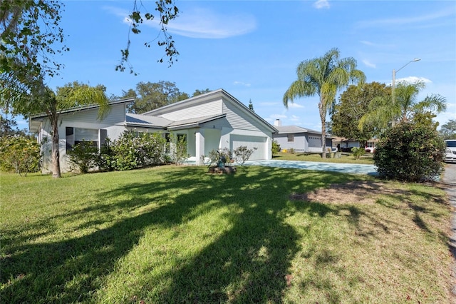 exterior space featuring a front lawn and a garage