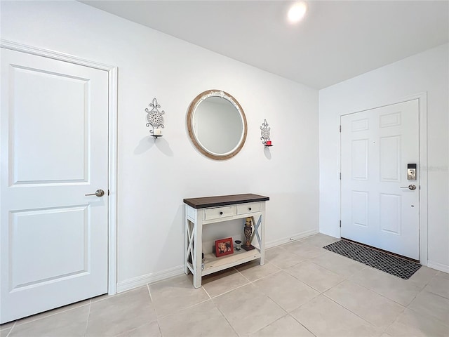 entryway with light tile patterned floors