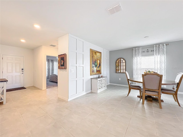 dining space with light tile patterned floors