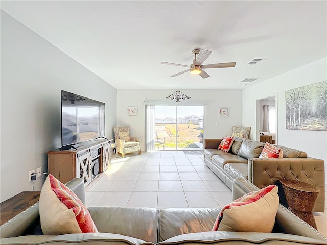 living room featuring light tile patterned floors and ceiling fan