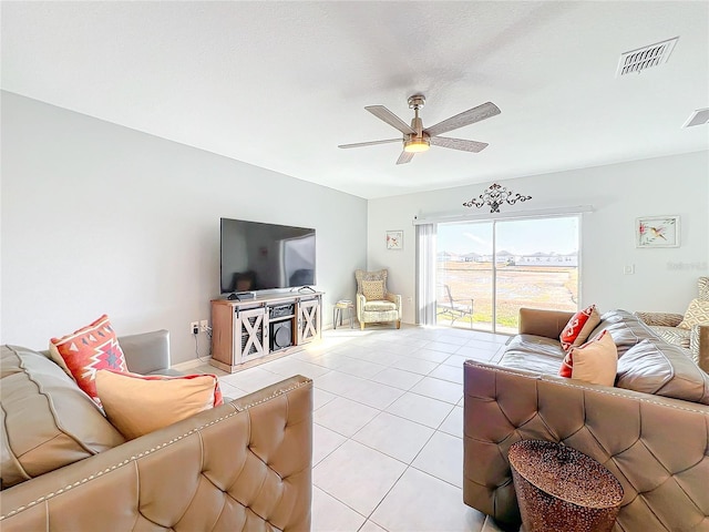 living room featuring ceiling fan and light tile patterned flooring