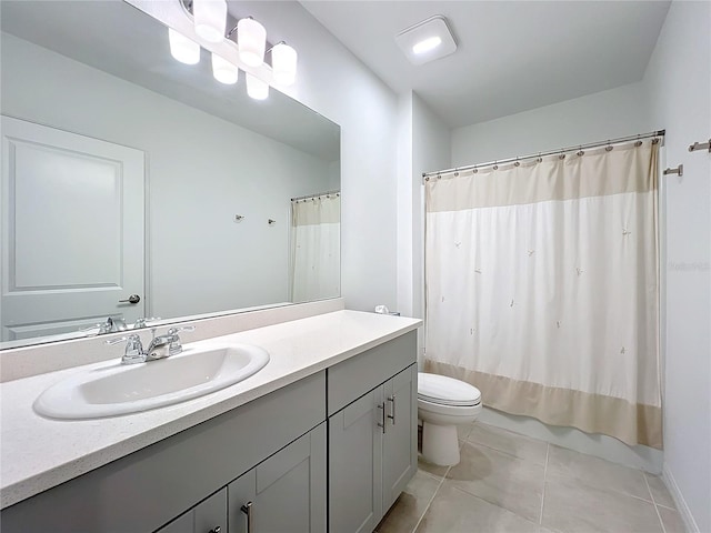 full bathroom featuring tile patterned floors, vanity, toilet, and shower / bath combo with shower curtain