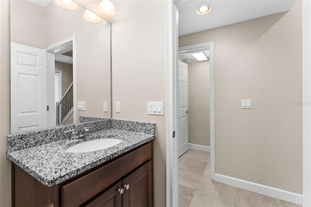 bathroom featuring tile patterned floors and vanity