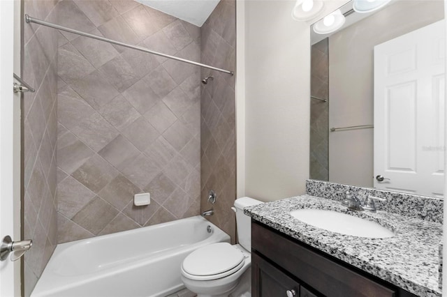 full bathroom featuring vanity, toilet, and tiled shower / bath