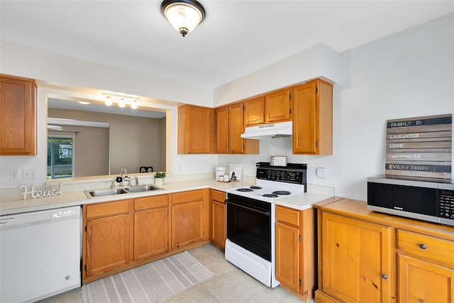 kitchen with sink, light tile patterned flooring, electric stove, and dishwasher