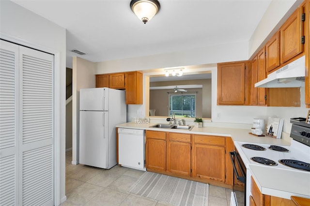 kitchen featuring white appliances, ceiling fan, light tile patterned flooring, and sink