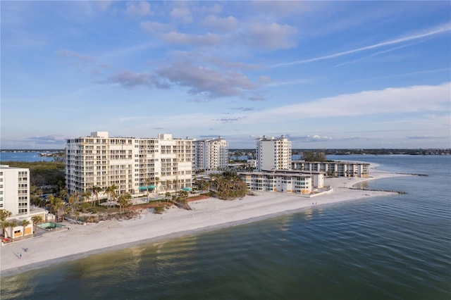 aerial view with a water view and a view of the beach