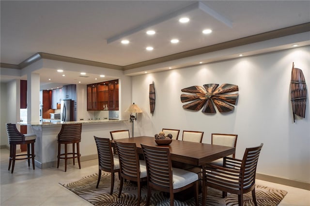 dining space with light tile patterned floors