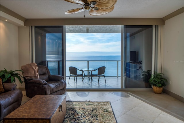 tiled living room with ceiling fan