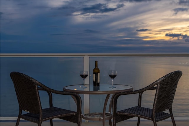 balcony at dusk with a water view