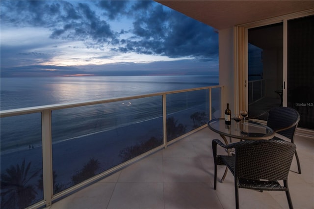 balcony at dusk with a water view