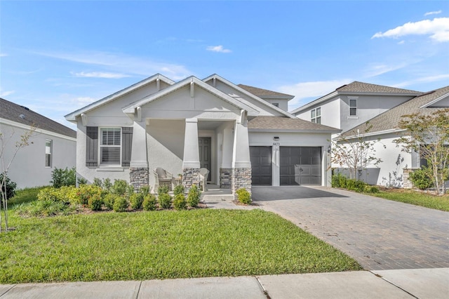 view of front of home with a garage and a front yard