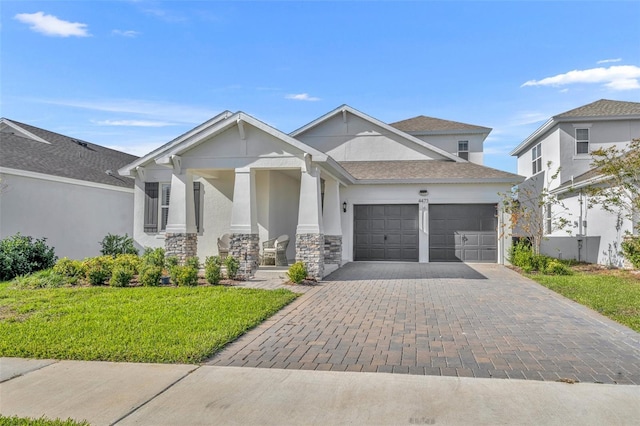 view of front facade featuring a garage and a front lawn