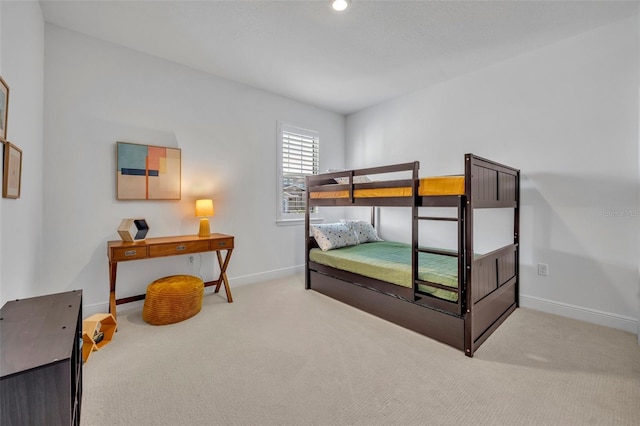 bedroom with light carpet