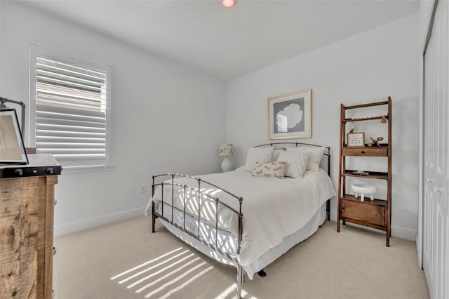 carpeted bedroom with a closet