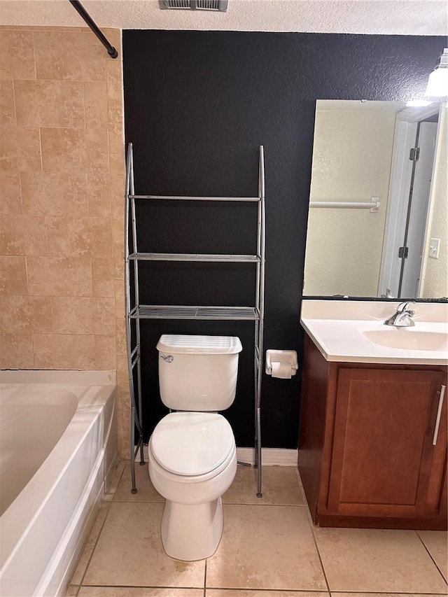 full bathroom with tile patterned flooring, bathtub / shower combination, vanity, and toilet