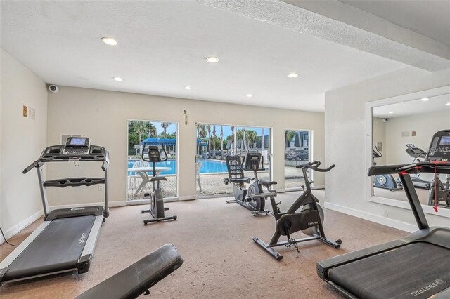 exercise room featuring a textured ceiling