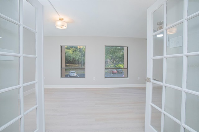 unfurnished room featuring light hardwood / wood-style flooring