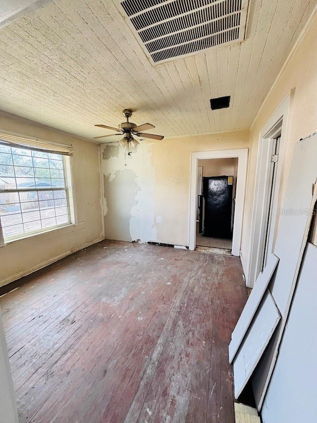 unfurnished living room with ceiling fan and hardwood / wood-style floors