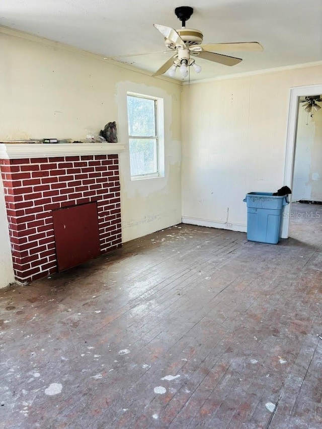 unfurnished living room featuring ceiling fan, crown molding, and wood-type flooring