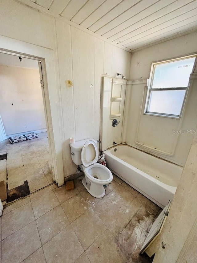 bathroom featuring  shower combination, toilet, and wooden ceiling