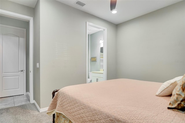 carpeted bedroom featuring ceiling fan and connected bathroom