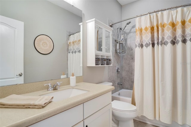 full bathroom with shower / bath combo with shower curtain, vanity, and toilet