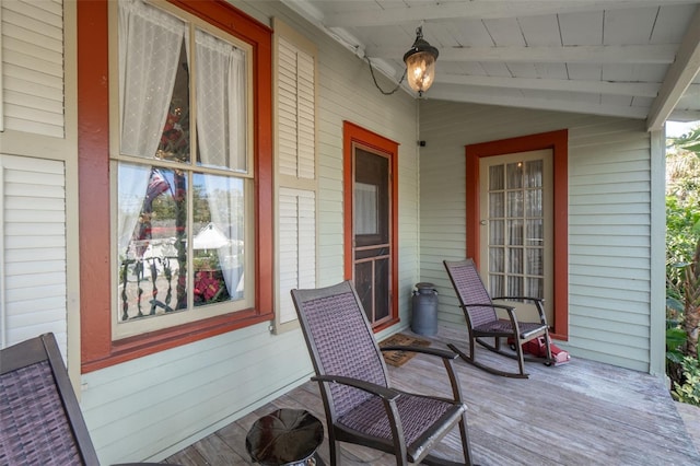 wooden terrace with a porch