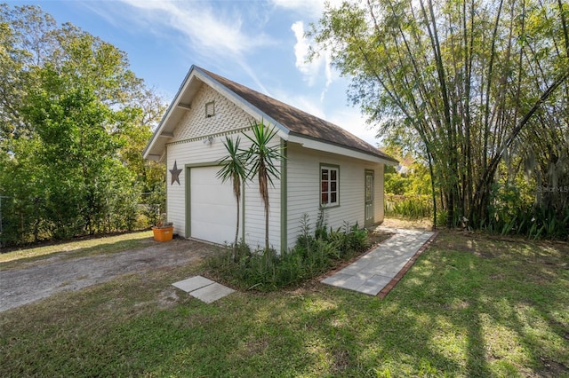 garage featuring a yard