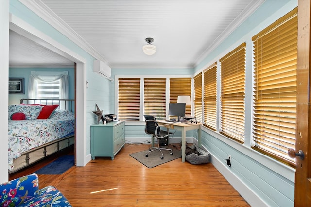 interior space with ornamental molding, a wall mounted air conditioner, and light hardwood / wood-style floors