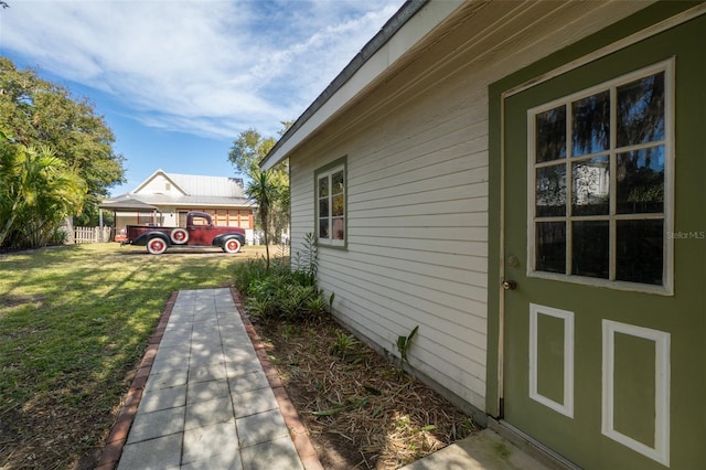 view of home's exterior with a lawn