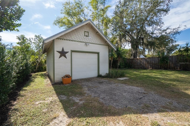 garage with a yard