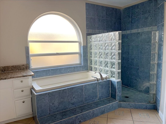 bathroom featuring walk in shower, a bath, and tile patterned floors